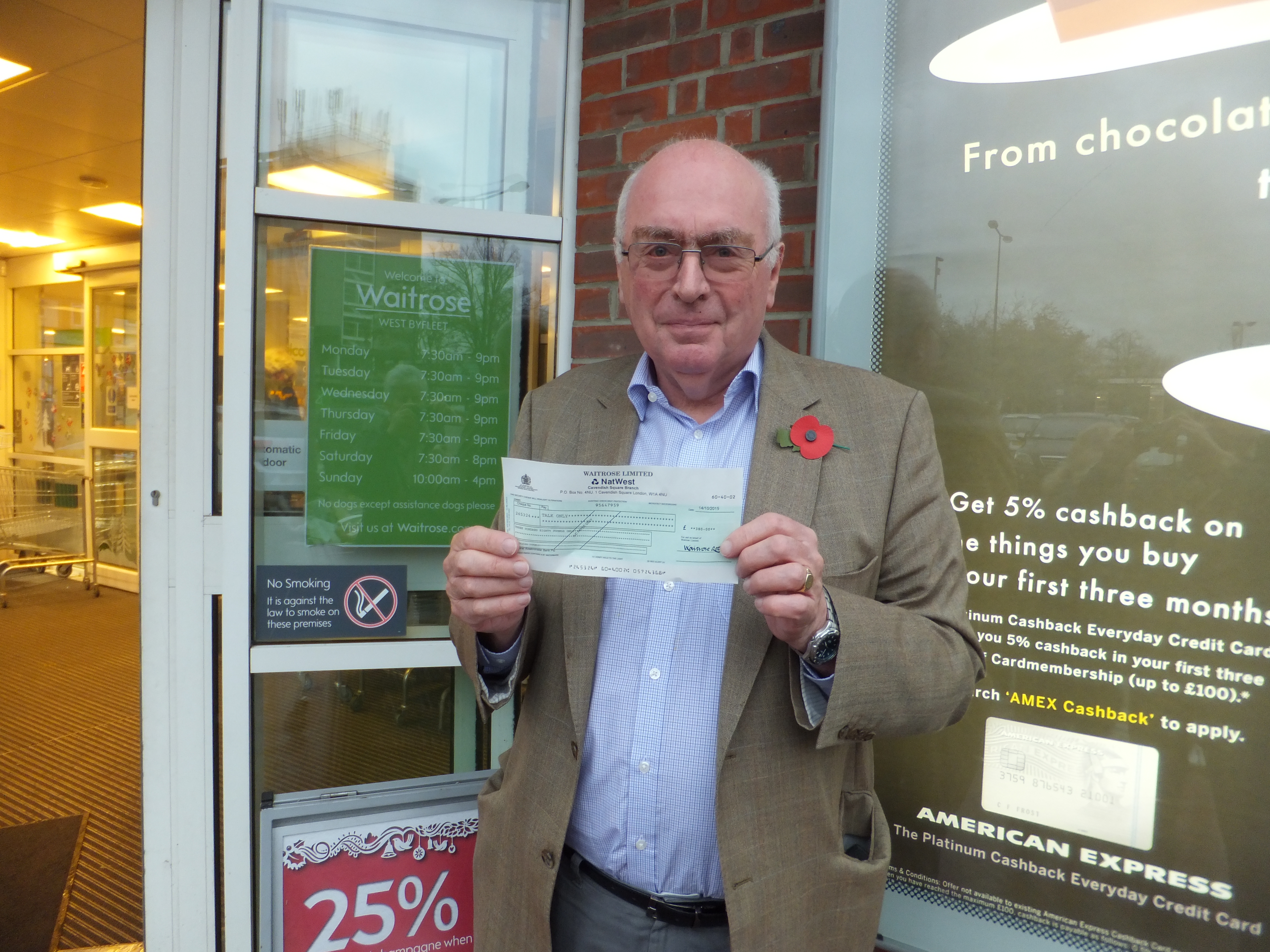MH collecting cheque at Waitrose WByfleet d6f7e